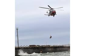 RNLI rescue 22-year-old from sea near Fraser Firing Ranges at Langstone in 'challenging conditions' with the help of the Coastguard Helicopter. 
Picture: Picture: RNLI/ Luke Kierman
