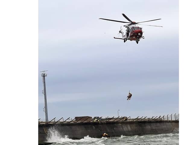 RNLI rescue 22-year-old from sea near Fraser Firing Ranges at Langstone in 'challenging conditions' with the help of the Coastguard Helicopter. 
Picture: Picture: RNLI/ Luke Kierman
