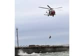 RNLI rescue 22-year-old from sea near Fraser Firing Ranges at Langstone in 'challenging conditions' with the help of the Coastguard Helicopter. 
Picture: Picture: RNLI/ Luke Kierman
