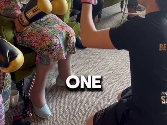 Bailey-Greetham Clark teaches boxing to care home residents.