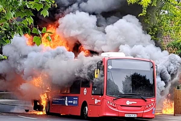 Fire rages through bus as 30 firefighters tackle blaze.