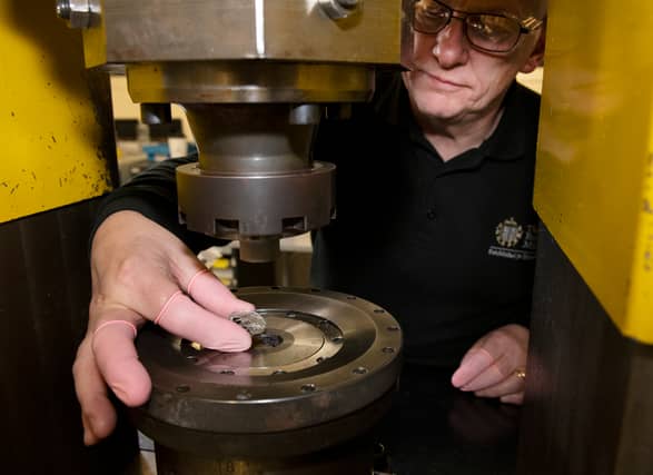 A D-Day 80th anniversary 50p coin in production. Designed by David Lawrence and supported by the experts at the Imperial War Museums, the design portrays Allied soldiers landing in Normandy. Picture: Royal Mint/PA Wire.