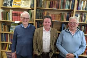 Photo issued by Oxfam of (from left) Stuart Murray, Simon Berry and Richard Danns who made the discovery of a General Signal Book 1917, a very rare lead-lined naval signal book from the First World War, which has been bought by a museum after being found in an Oxfam bookshop. The book, which is filled with confidential signals, was found with a box of donations at the back of Oxfam's Bath bookshop by the shop manager Simon Berry. 
PA Photo. Photo credit should read: Oxfam/PA Wire 