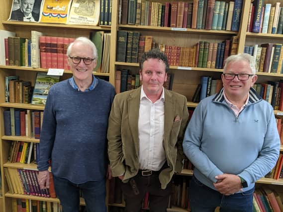 Photo issued by Oxfam of (from left) Stuart Murray, Simon Berry and Richard Danns who made the discovery of a General Signal Book 1917, a very rare lead-lined naval signal book from the First World War, which has been bought by a museum after being found in an Oxfam bookshop. The book, which is filled with confidential signals, was found with a box of donations at the back of Oxfam's Bath bookshop by the shop manager Simon Berry.
PA Photo. Photo credit should read: Oxfam/PA Wire
