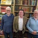 Photo issued by Oxfam of (from left) Stuart Murray, Simon Berry and Richard Danns who made the discovery of a General Signal Book 1917, a very rare lead-lined naval signal book from the First World War, which has been bought by a museum after being found in an Oxfam bookshop. The book, which is filled with confidential signals, was found with a box of donations at the back of Oxfam's Bath bookshop by the shop manager Simon Berry. 
PA Photo. Photo credit should read: Oxfam/PA Wire 