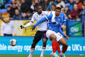 Bolton's Paris Maghoma battles Pompey midfielder Tino Anjorin for the ball during the Blues' trip to the Toughsheet Community Stadium in April
