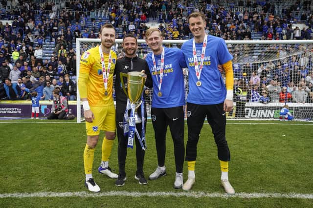 Matt Macey (far right) celebrates winning the League One title with Will Norris, goalkeeping coach Joe Prodomo and Ryan Schofield. Picture: Jason Brown/ProSportsImages