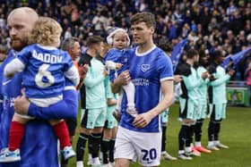 Sean Raggett walking out onto the Fratton Park pitch as a Pompey player ahead of the game against Wigan on April 20