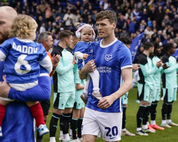 Sean Raggett walking out onto the Fratton Park pitch as a Pompey player ahead of the game against Wigan on April 20