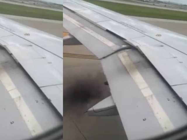 Plane’s engine catches fire as black smoke billows from wing.