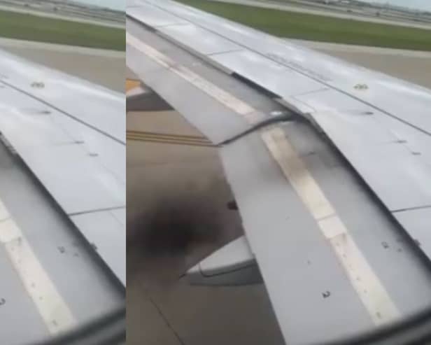 Plane’s engine catches fire as black smoke billows from wing.
