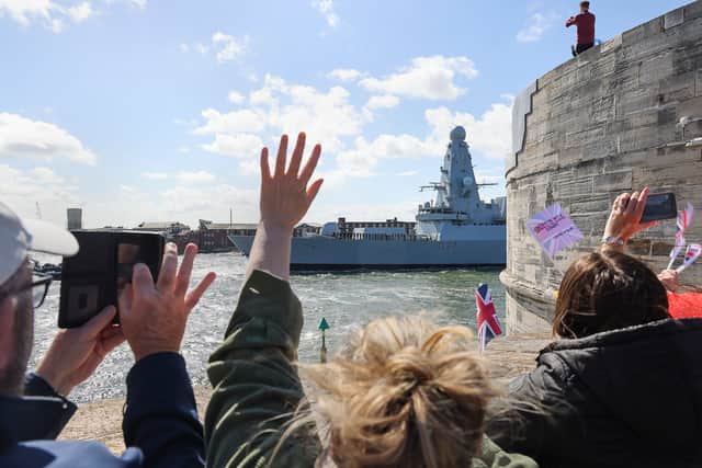 Families gathered along the walls of Old Portsmouth to wave off their loved ones as HMS Duncan sailed from HMNB Portsmouth on deployment on May 27. Picture: Royal Navy