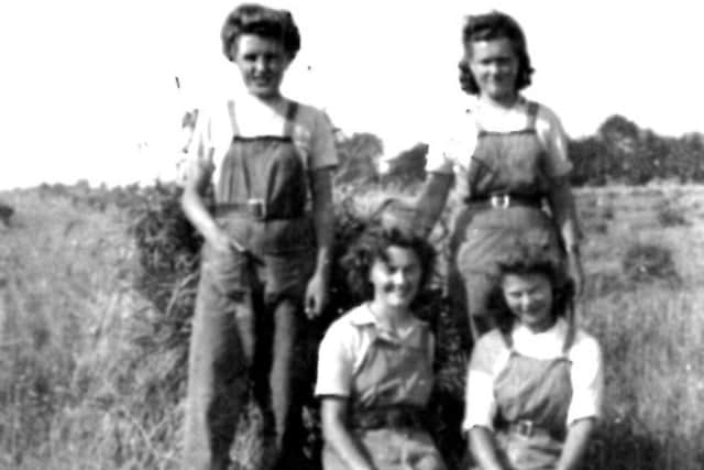Doris Houghton, centre, has vivid memories of volunteering with the WLA during the Second World War.