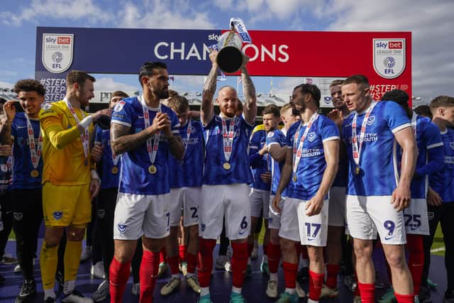 Connor Ogilvie holds aloft the League One trophy. Picture: Jason Brown/ProSportsImages