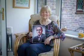 Valerie Godwin at her Emsworth home with a picture of Adrien Jouvin Sharp, her grandfather and the man who designed the D-Day memorial stone in Southsea. He was Portsmouth's first city architect. Picture: Habibur Rahman
