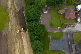 Cracks appear in driveways after start of nearby building work.