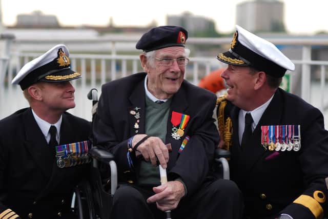 (left to right) Royal Navy Commander Glen Hickson, D-Day veteran Jim Grant, and Royal Navy Commodore John Voyce, on board the Brittany Ferries ship Mont St Michel as prepares to sail from Portsmouth Harbour in the UK to Ouistreham, in Caen, France, carrying 31 D-Day and Normandy veterans who are travelling with the Royal British Legion and Spirit of Normandy Trust to take part in commemorations to mark the 80th anniversary of D-Day.
Picture credit: Jordan Pettitt/PA Wire