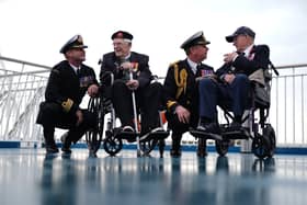 (left to right) Royal Navy Commander Glen Hickson, D-Day veteran Jim Grant, Royal Navy Commodore John Voyce, and D-Day veteran Charles Horne, on board the Brittany Ferries ship Mont St Michel as it prepares to sail from Portsmouth Harbour in the UK to Ouistreham, in Caen, France, carrying 31 D-Day and Normandy veterans who are travelling with the Royal British Legion and Spirit of Normandy Trust to take part in commemorations to mark the 80th anniversary of D-Day. 
Photo credit should read: Jordan Pettitt/PA Wire