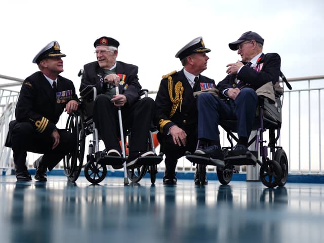 (left to right) Royal Navy Commander Glen Hickson, D-Day veteran Jim Grant, Royal Navy Commodore John Voyce, and D-Day veteran Charles Horne, on board the Brittany Ferries ship Mont St Michel as it prepares to sail from Portsmouth Harbour in the UK to Ouistreham, in Caen, France, carrying 31 D-Day and Normandy veterans who are travelling with the Royal British Legion and Spirit of Normandy Trust to take part in commemorations to mark the 80th anniversary of D-Day. 
Photo credit should read: Jordan Pettitt/PA Wire