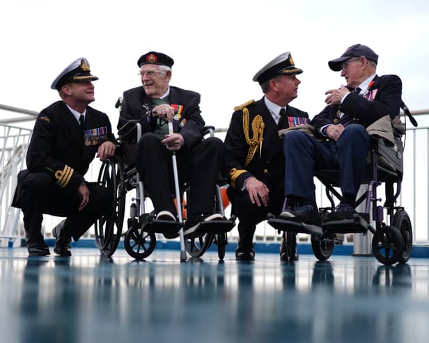 (left to right) Royal Navy Commander Glen Hickson, D-Day veteran Jim Grant, Royal Navy Commodore John Voyce, and D-Day veteran Charles Horne, on board the Brittany Ferries ship Mont St Michel as it prepares to sail from Portsmouth Harbour in the UK to Ouistreham, in Caen, France, carrying 31 D-Day and Normandy veterans who are travelling with the Royal British Legion and Spirit of Normandy Trust to take part in commemorations to mark the 80th anniversary of D-Day. 
Photo credit should read: Jordan Pettitt/PA Wire