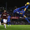 Peter Crouch attempts an overhead kick as he is watched on by AC Milan's Gennaro Gattuso