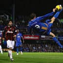Peter Crouch attempts an overhead kick as he is watched on by AC Milan's Gennaro Gattuso