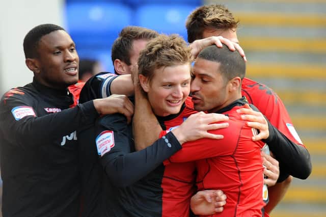 Pompey celebrate Erik Huseklepp's first goal against Peterborough in January 2012. Picture: PA
