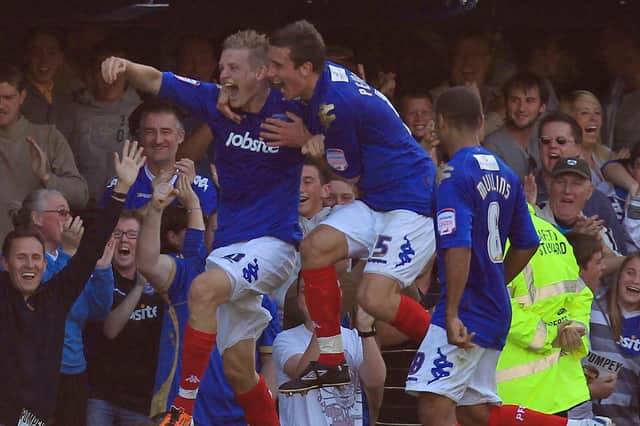 Erik Huseklepp celebrates his 94th-minute winner against Peterborough at Fratton Park in September 2011. Picture: PA