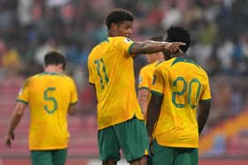 Pompey striker Kusini Yengi celebrates scoring Australia's second goal in their FIFA World Cup Asian qualifier Group I match against Bangladesh at Bashundhara Kings Arena.