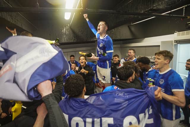 Paddy Lane starts as he means to go on in the dressing room after promotion is sealed against Barnsley.