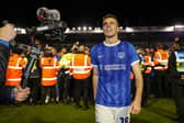 Battered, bruised and the man who delivered the title against Barnsley - Conor Shaughnessy.