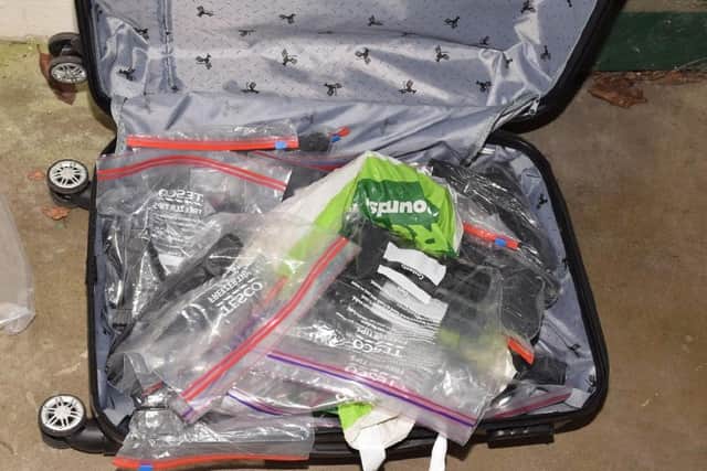 At Westerham Close, officers found 70 firearms and over 600 rounds of ammunition that had been hidden in a number of suitcases.
