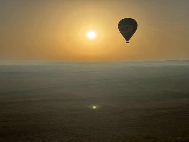 Journalist Nicola Adam journeys across the Dubai desert at dawn by hot air balloon


