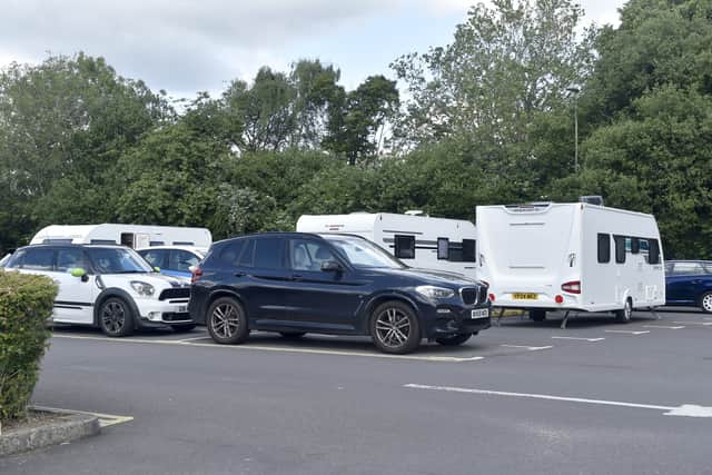 Travellers at Fareham Leisure Centre on Tuesday, June 11, 2024. Police and local authority officials are at the scene. The group have been ordered to move. Picture: Sarah Standing (110624-4421)