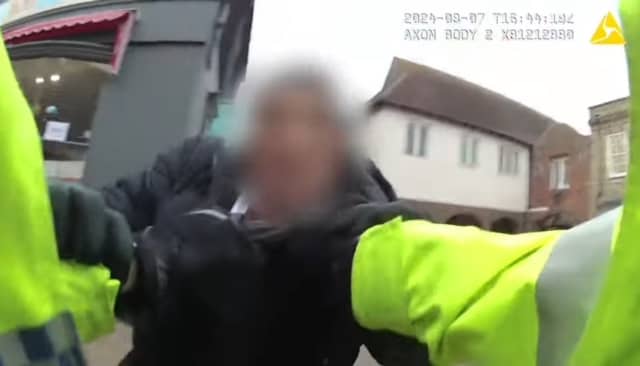 PC Ryan McNamara arrests James Happer.