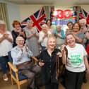 Hannah Bentley had her head shaved for MacMillan, in Glamis Court, Stubbington. Ms Bentley is pictured with professional hairdresser Samantha Hughes, front left, and residents
Picture: Chris  Moorhouse (120624-10)