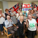 Hannah Bentley had her head shaved for MacMillan, in Glamis Court, Stubbington. Ms Bentley is pictured with professional hairdresser Samantha Hughes, front left, and residents
Picture: Chris  Moorhouse (120624-10)
