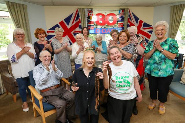 Hannah Bentley had her head shaved for MacMillan, in Glamis Court, Stubbington, as residents cheered her on.