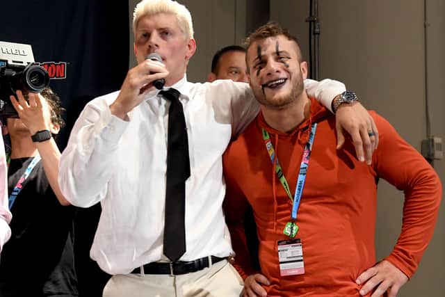 (L-R) Cody Rhodes and Maxwell Jacob Friedman aka MJF make a surprise appearance during the All Elite Wrestling panel during 2019 New York Comic Con at Jacob Javits Center on October 04, 2019 in New York City. (Photo by Noam Galai/Getty Images for WarnerMedia Company)