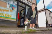 Shop worker Tracey Way, 61, pours Inch's Cider down the drain.
