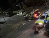 A still from a video uploaded by X account UB1UB2 West London (Southall) of a cow being rammed by a police car in Feltham on June 14, 2024 