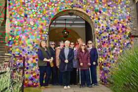 Pictured is: Suzy Jackson (centre) with her team of Yarn Bombers.Picture: Keith Woodland 