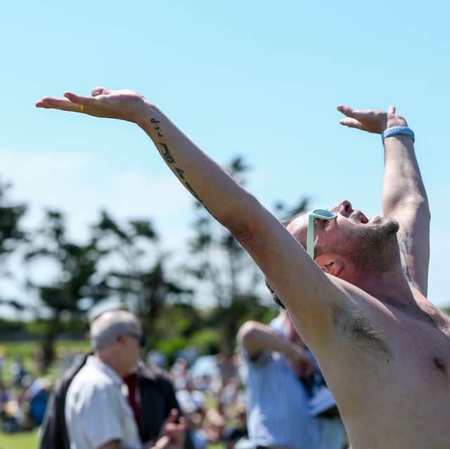 A music lover enjoys Live at the Bandstand.
