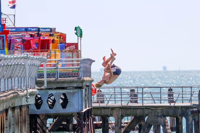 Tombstoning risks "serious injury or even death", warns council as action plan set up to deter youngsters leaping into the Portsmouth seas. Pictured - Kids throwing themselves from South Parade Pier in 2022.