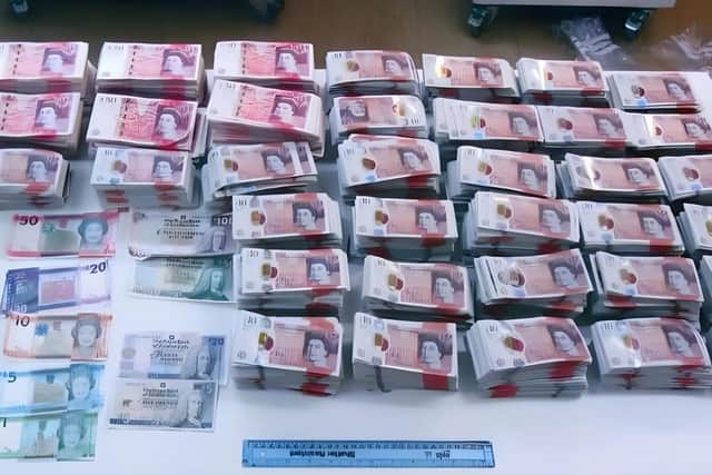 A large quantity of cash was seized by the police. James Alexander Green and Paul Green were jailed for various offences. Picture: Hampshire and Isle of Wight Constabulary