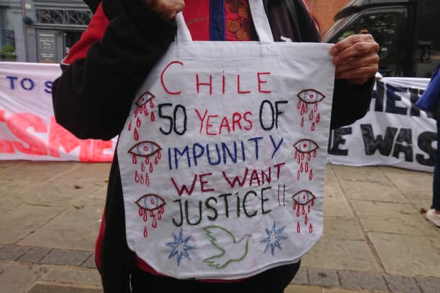 Demonstrators gathered outside the Victory Gate in Portsmouth to protest against CNS Esmeralda and the ship's use as an ambassadorial vessel for Chile. Picture: The News
