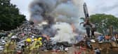 Firefighters tackling a blaze at a scrap yard in Buriton near Petersfield yesterday (July 1). Picture: HIWFRS