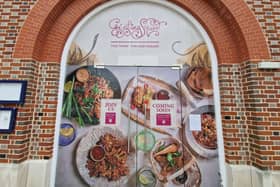 Temporary signage adorns the doors of the iconic Vulcan building in Gunwharf Quays as the site is being transformed into a home for Giggling Squid which will open this month. 