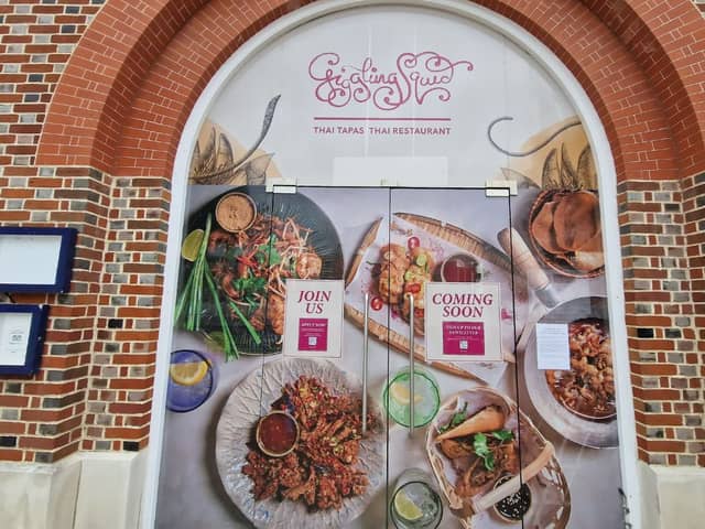 Temporary signage adorns the doors of the iconic Vulcan building in Gunwharf Quays as the site is being transformed into a home for Giggling Squid which will open this month. 