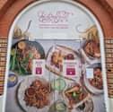 Temporary signage adorns the doors of the iconic Vulcan building in Gunwharf Quays as the site is being transformed into a home for Giggling Squid which will open this month. 